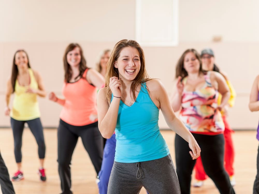 gym members during a zumba group fitness class at a gym near me corpus christi on airline