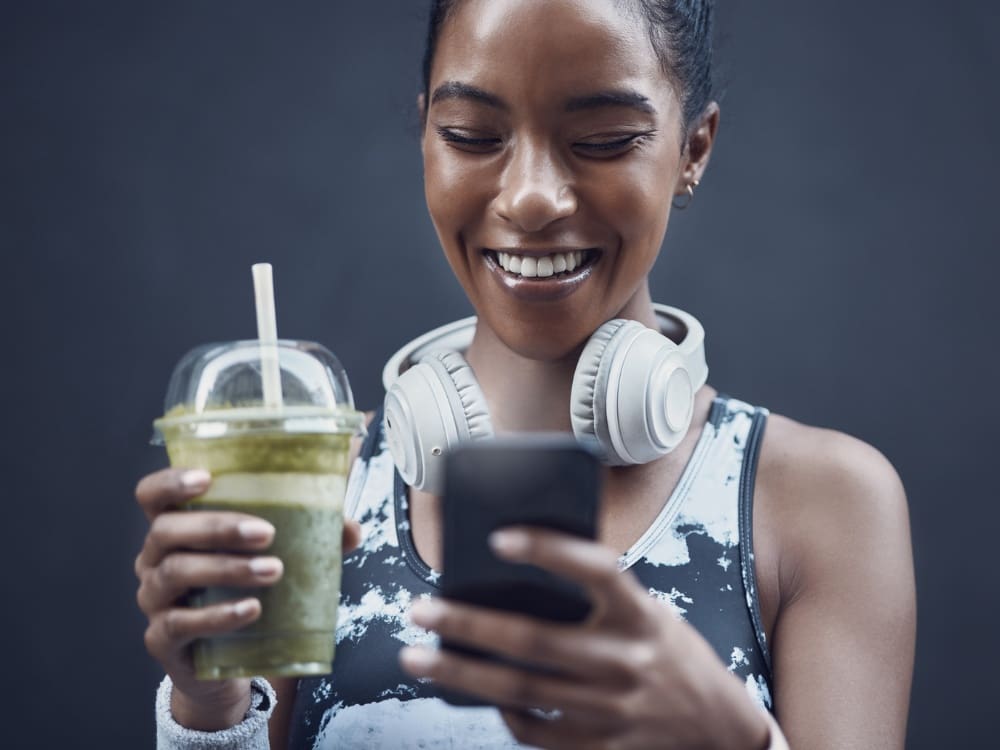 a gym member enjoys a smoothie from the smoothie bar at a gym near me in corpus christi airline