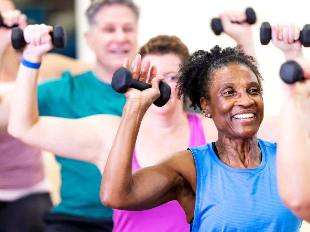 senior gym members participate in a senior group fitness class at freedom fitness gym in corpus christi