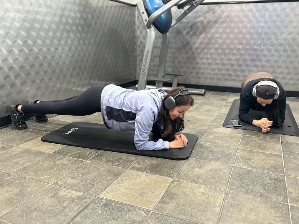 gym members use the functional training area at freedom fitness gym in alameda for a core workout