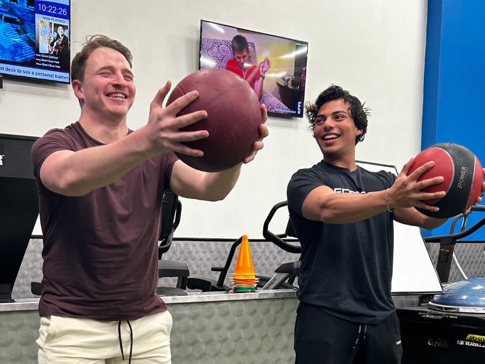 a gym member and personal trainer work together at a gym near me in calallen