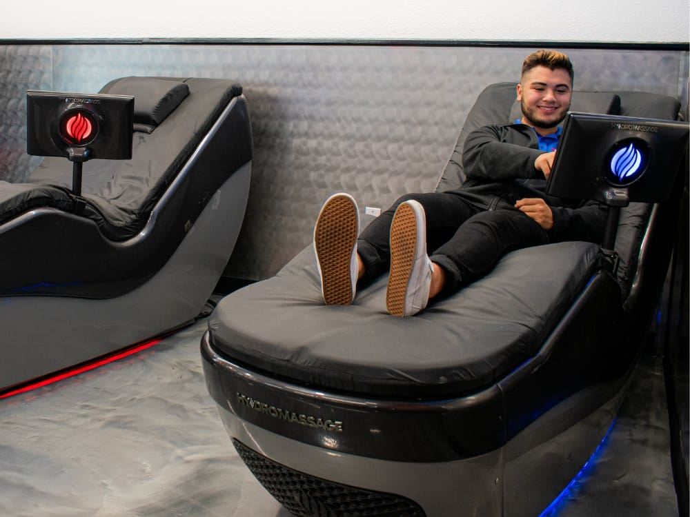 a gym member enjoys hydromassage therapy at a gym near me in calallen