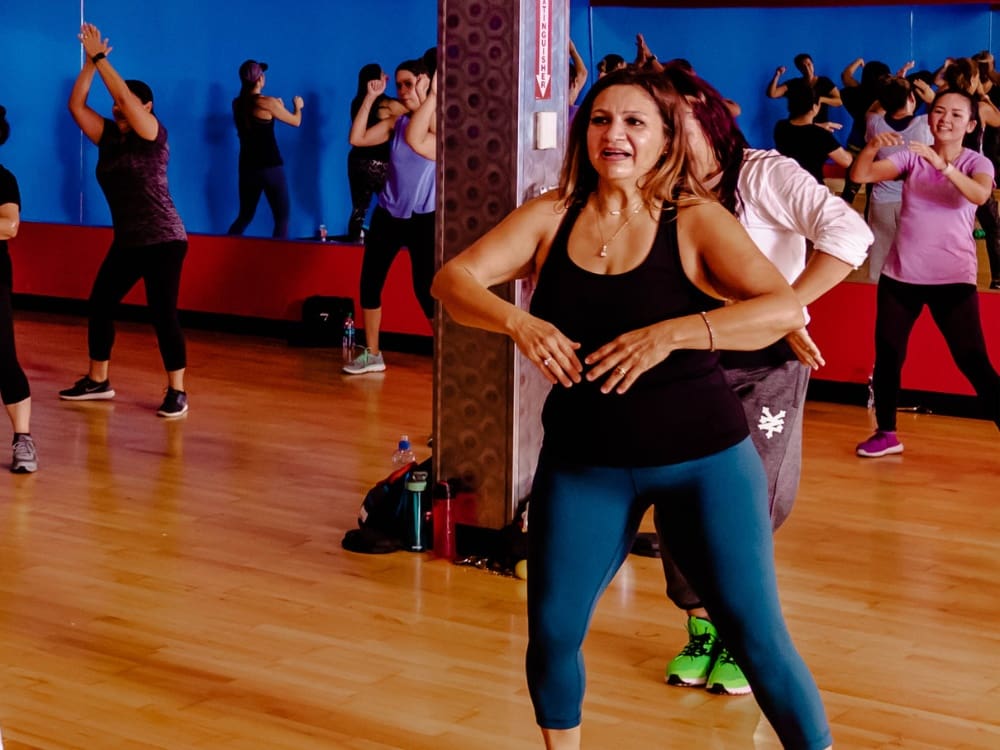 gym members during a zumba group fitness class at a gym near me