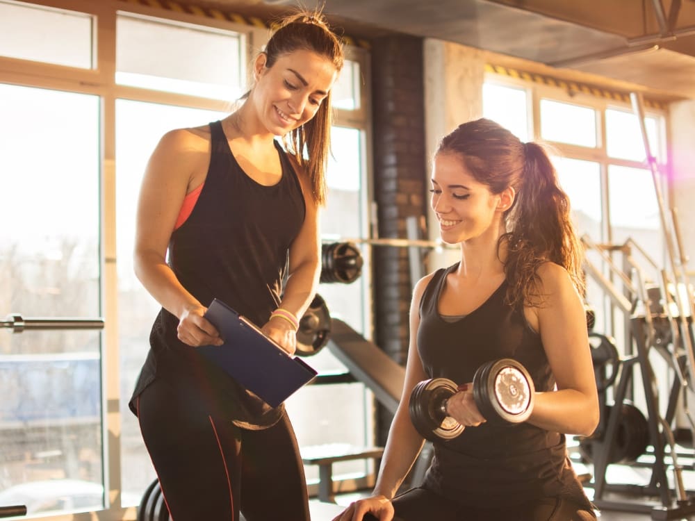 a gym member works with a nutritionist and trainer at freedom fitness gym in calallen