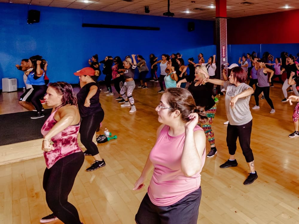 gym members dance during a group fitness zumba class at freedom fitness gym in corpus christi