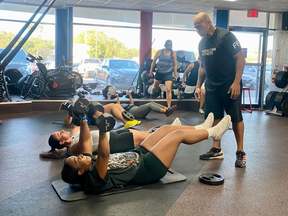 gym members train during a boot camp at freedom fitness gym in saratoga