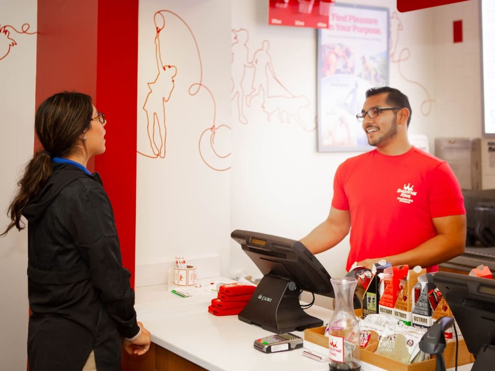 a gym member orders at smoothie king at freedom fitness gym in saratoga