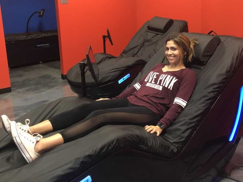 a gym member using hydromassage bed at freedom fitness gym in saratoga