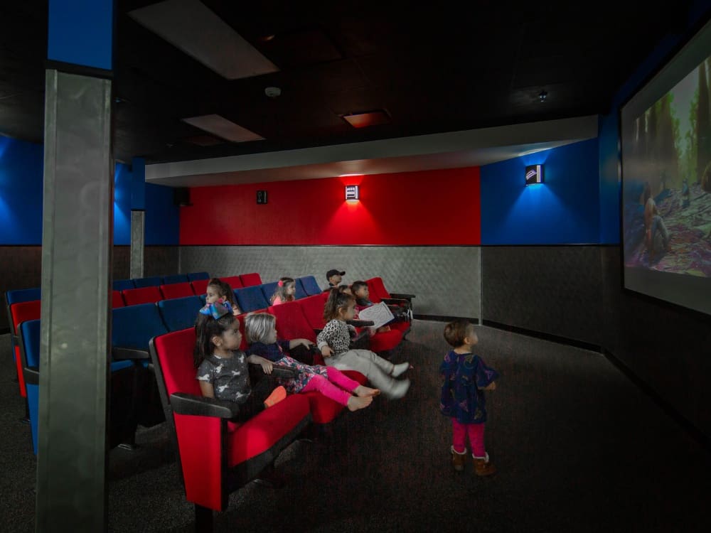 a movie theater at freedom fitness gym onsite childcare in saratoga