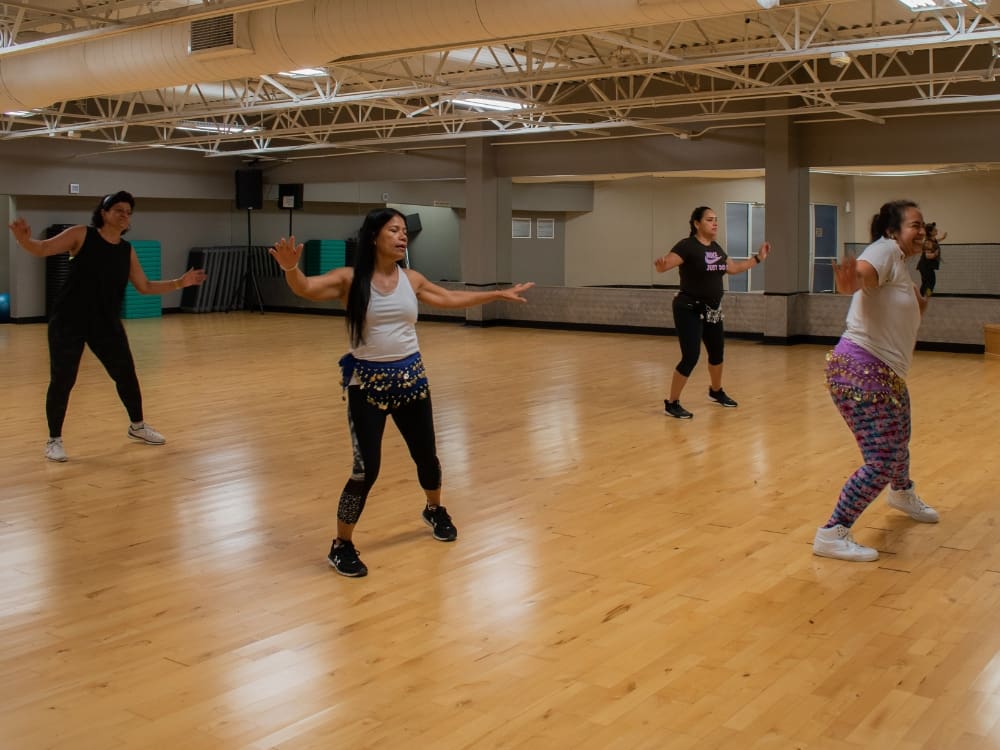 gym members during a zumba class at freedom fitness gym in saratoga