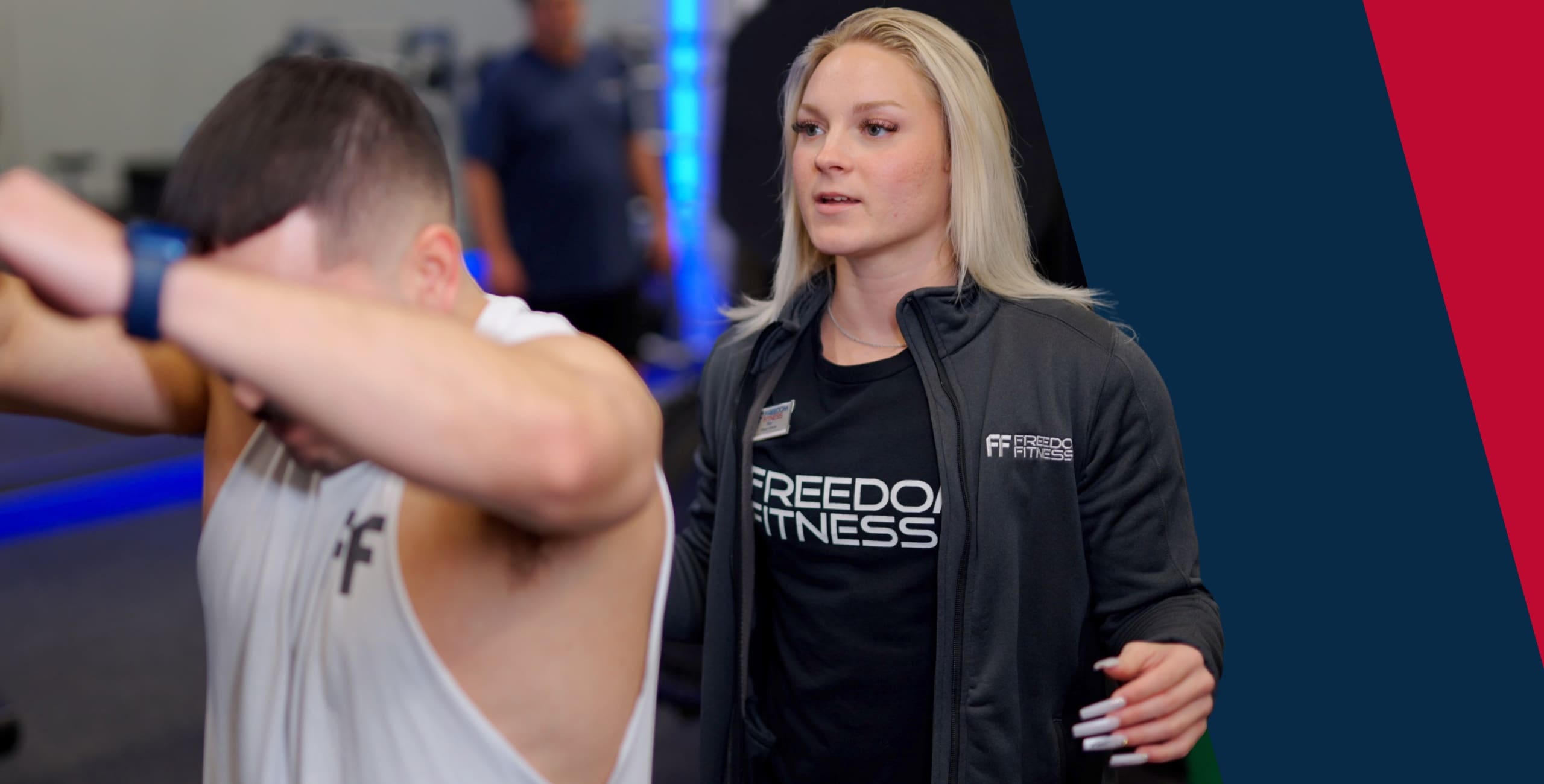 a personal trainer spots a gym member during a training session at freedom fitness gym in saratoga corpus christi