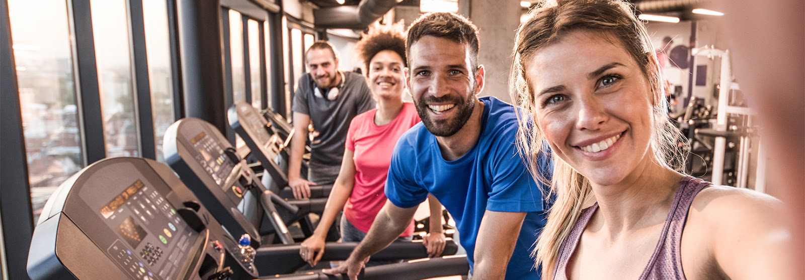 gym members cardio training on treadmills at freedom fitness