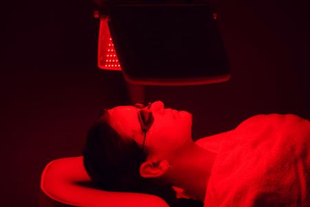 Relaxing and enjoying red light therapy.
