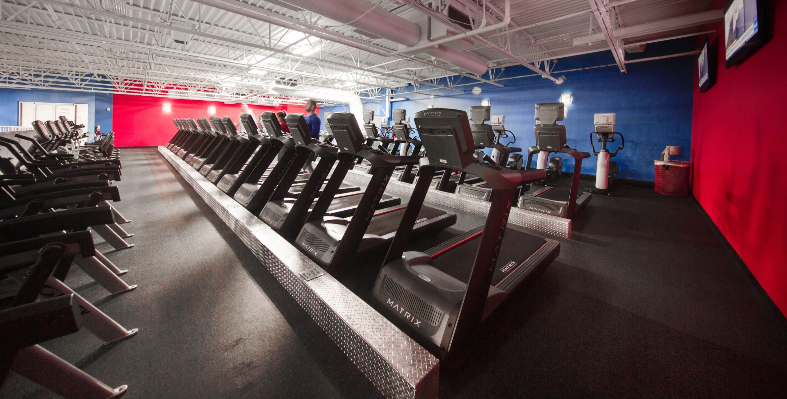 a spacious cardio fitness area with treadmills and other cardio equipment at freedom fitness in corpus christi