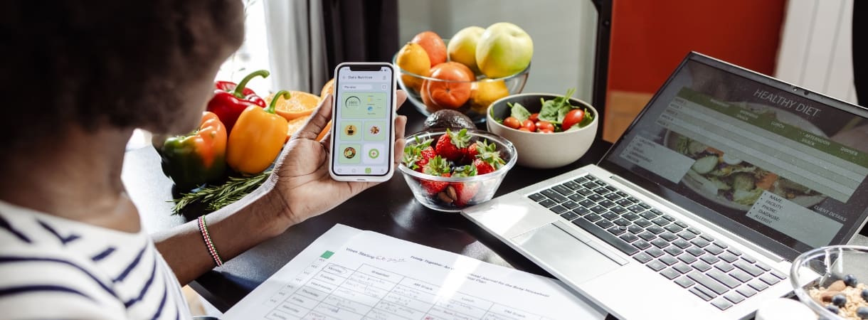 a gym member researches and tracks diet for nutrition guidance counseling at freedom fitness gym